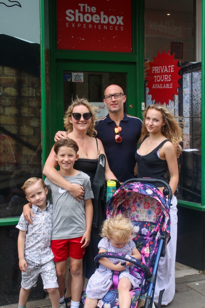 Family in front of The Shoebox experience in Norwich